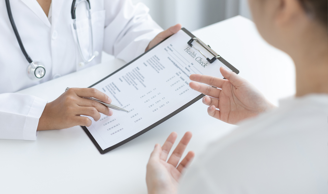 provider holding health check document on clipboard