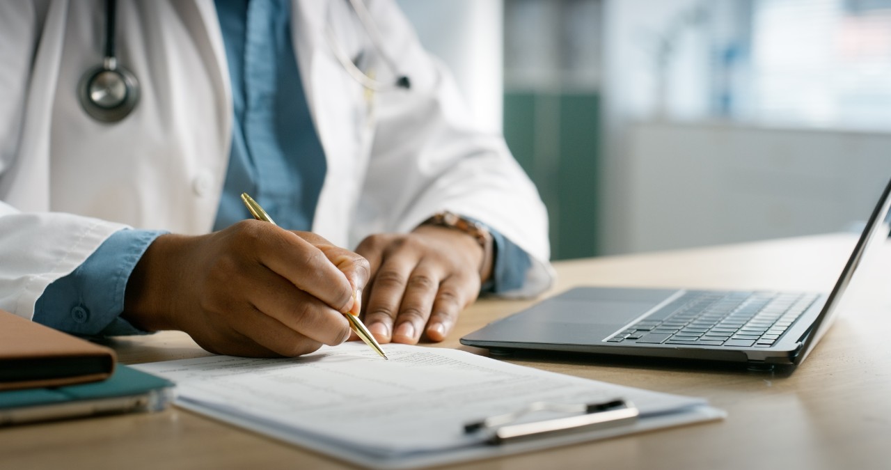 Healthcare, writing and hands of doctor with clipboard for insurance, medical service or wellness. Hospital, clinic and person with paperwork, documents and forms for prescription or patient report